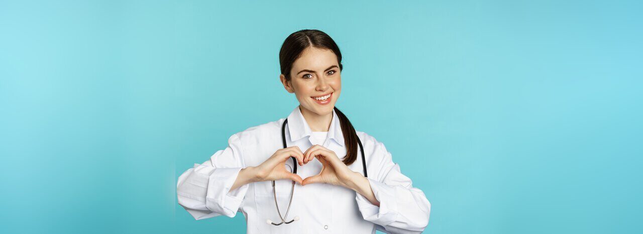 young-doctor-woman-physician-showing-heart-love-sign-smiling-care-patients-clinic-standin